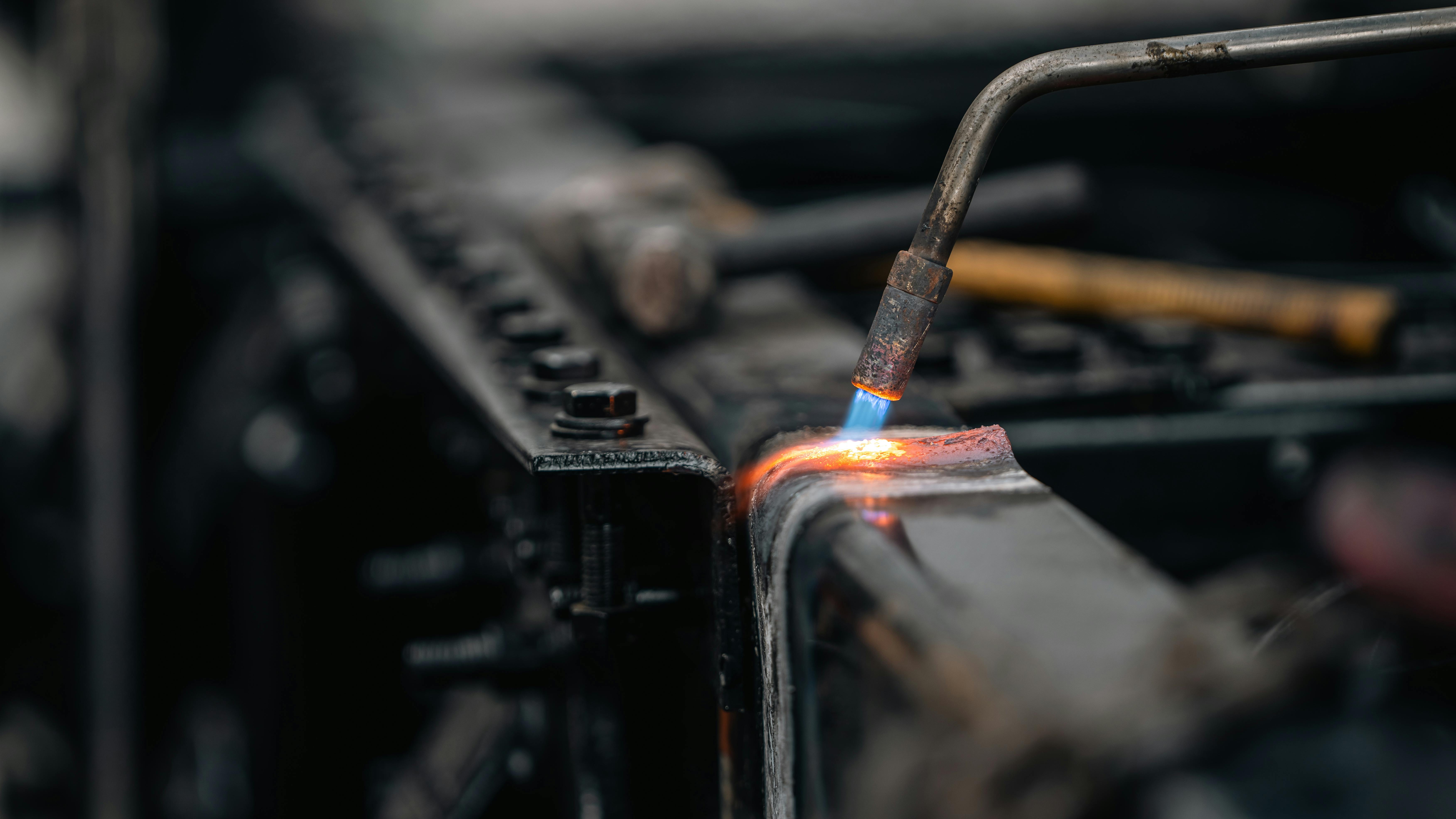 Numerical Analysis and Parametric Optimization of a Static Wavy Flag for Heat Transfer Enhancement