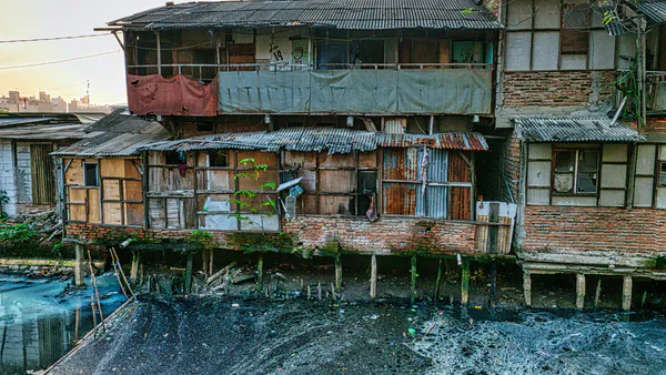 Strategic Integrative Approach of Urban Slum Community Development: A Case of Dushtha Shasthya Kendra in Bangladesh